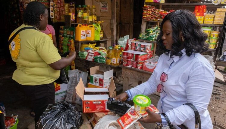 Merchant research in a market.